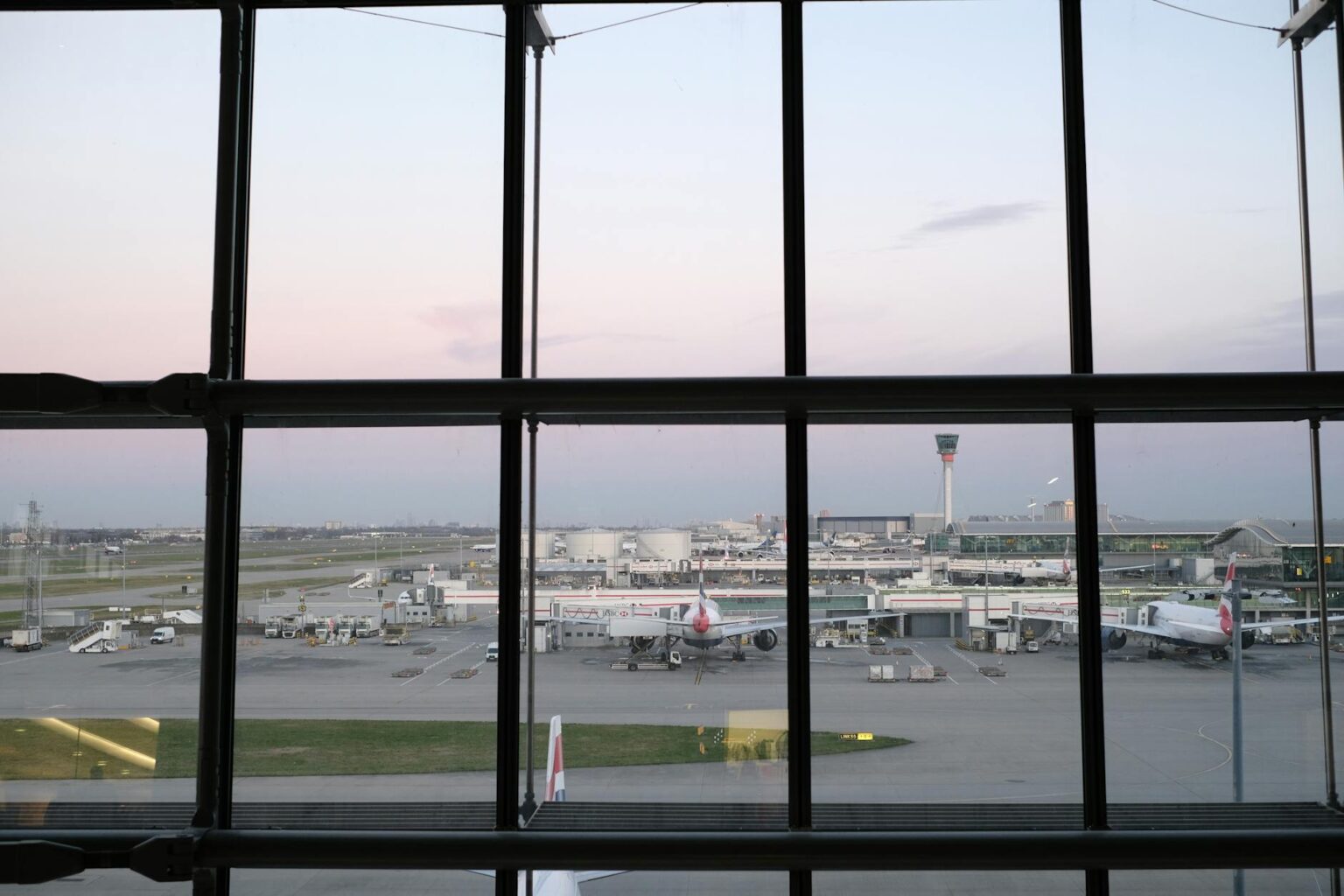 Modern airport terminal interior with passengers and baggage claim area