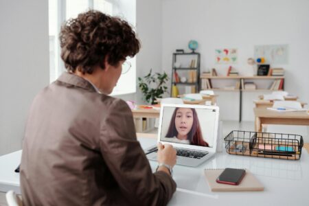 How AI Tutors Are Replacing Human Teachers in Private Schools Modern classroom with students using tablets and digital learning technology