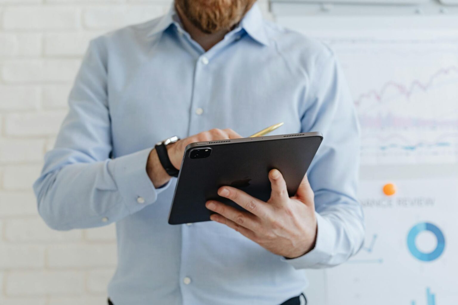 Testing Microsoft’s Surface Pro 10 Against iPad Pro for Business Professional using tablet device in modern office environment for business work