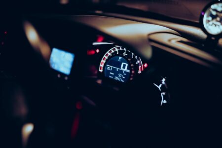Comparing Toyota’s Hydrogen Cars to Tesla’s Electric Vehicle Range Modern vehicle dashboard showing digital display and controls representing advanced automotive technology