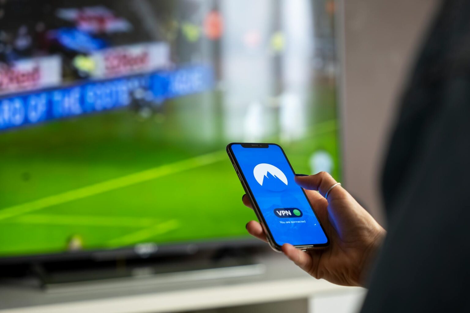 Modern smart TV displaying streaming content interface with remote control nearby