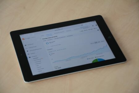 Modern tablet computer displaying colorful interface on clean white background