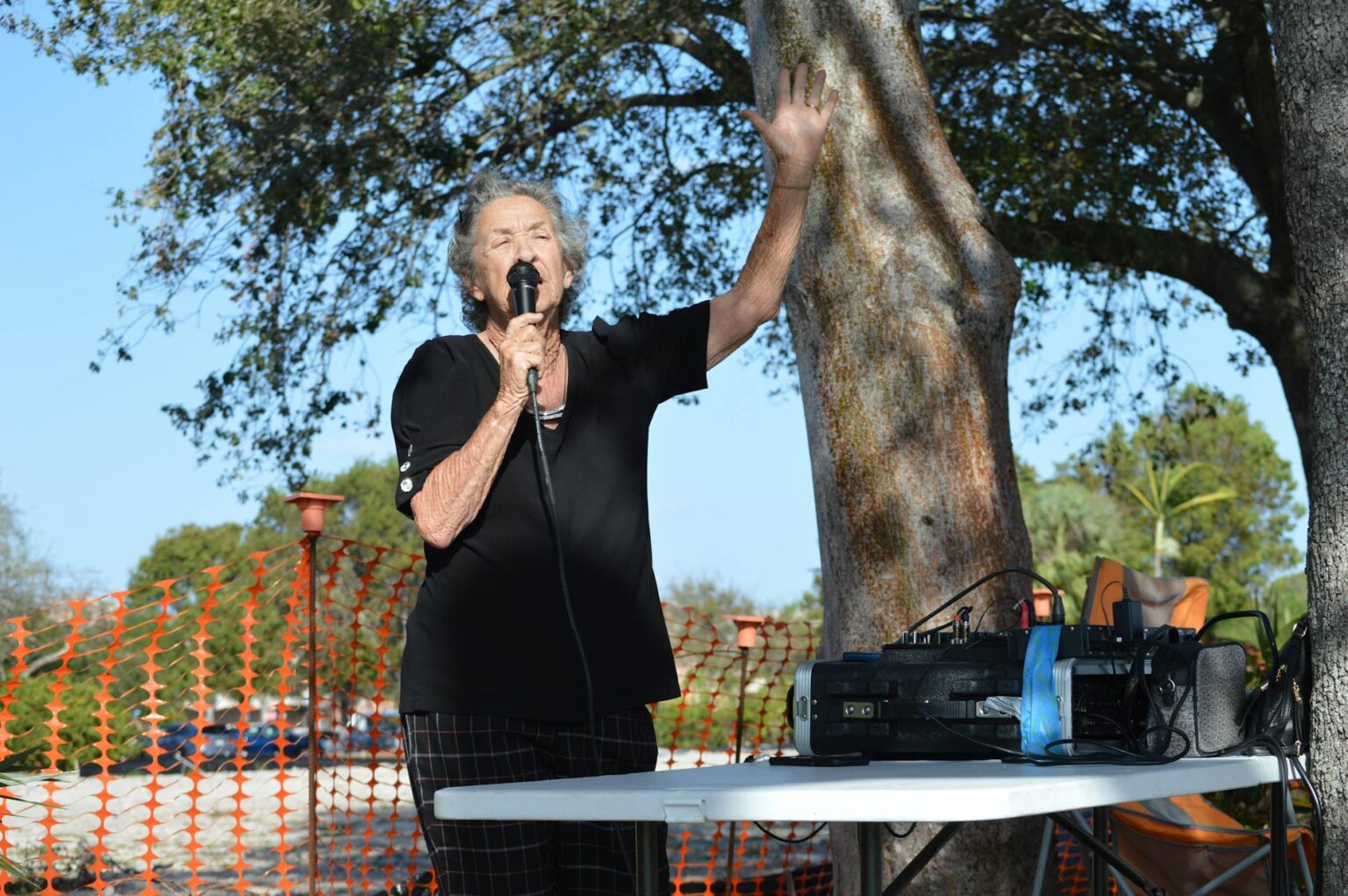 Woman speaking into microphone representing voice assistant interaction and speech recognition technology