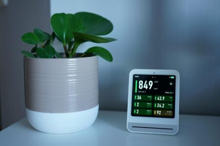 White portable air purifier running in modern living room during daytime