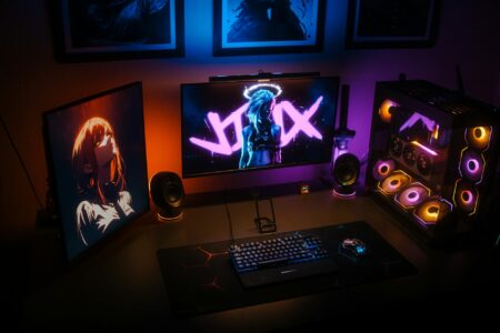Comparing Steam Deck OLED vs Nintendo Switch for Indie Gaming Modern handheld gaming devices on desk setup with controller and accessories