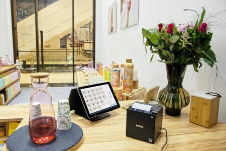 Modern retail store checkout area with technology systems and cameras for automated payment processing