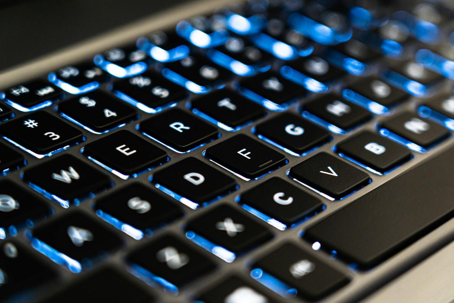 Close-up view of MacBook Pro keyboard and trackpad showing premium build quality