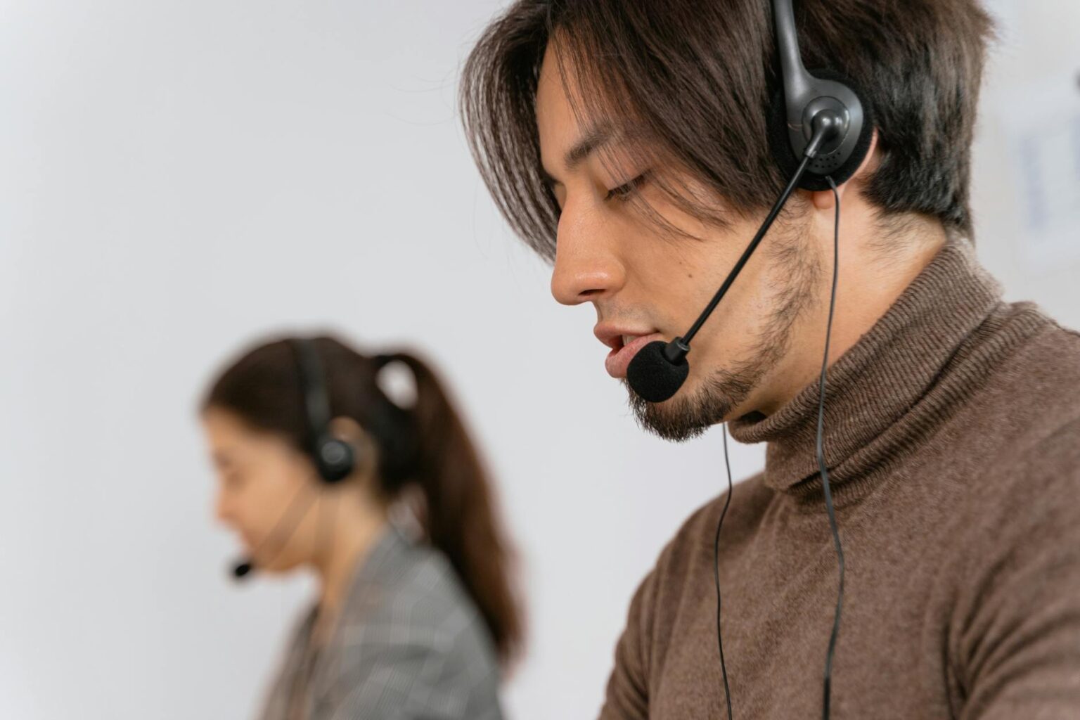 Meta’s AI Chatbots Now Handle Customer Service for Major Retailers Customer service representative wearing headset at computer workstation
