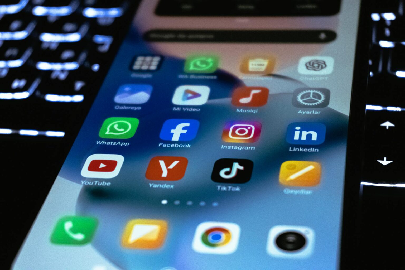 Person holding smartphone displaying social media content creation interface