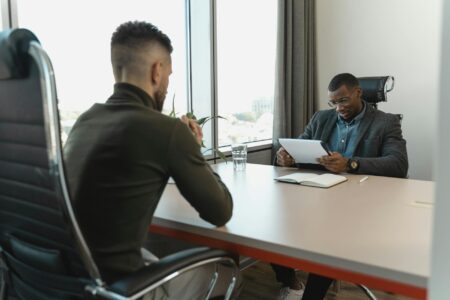 Professional business interview taking place in modern office setting