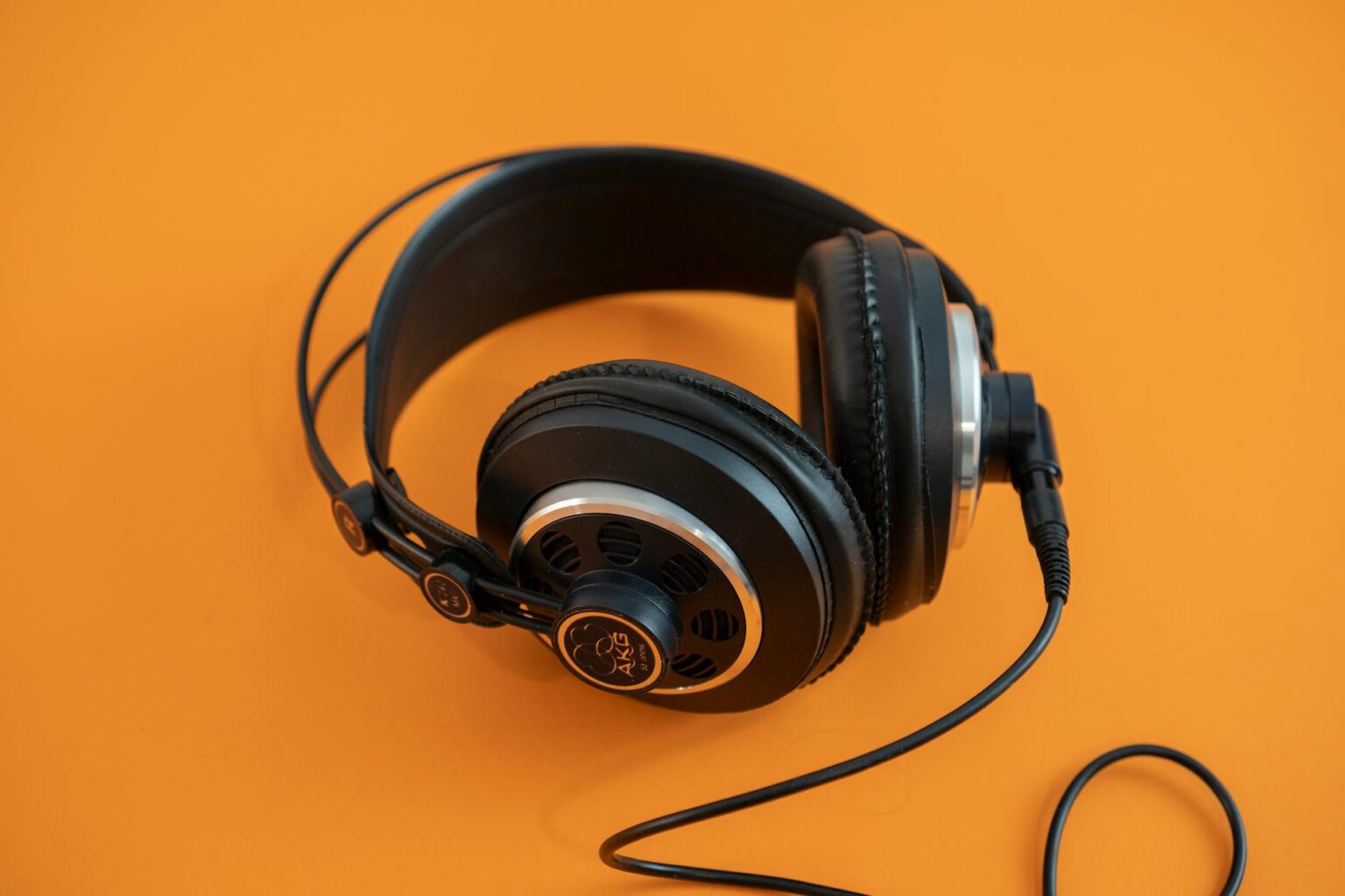 Spotify HiFi vs Apple Music Lossless Audio Quality Comparison Professional studio headphones on audio mixing desk for high-quality music listening