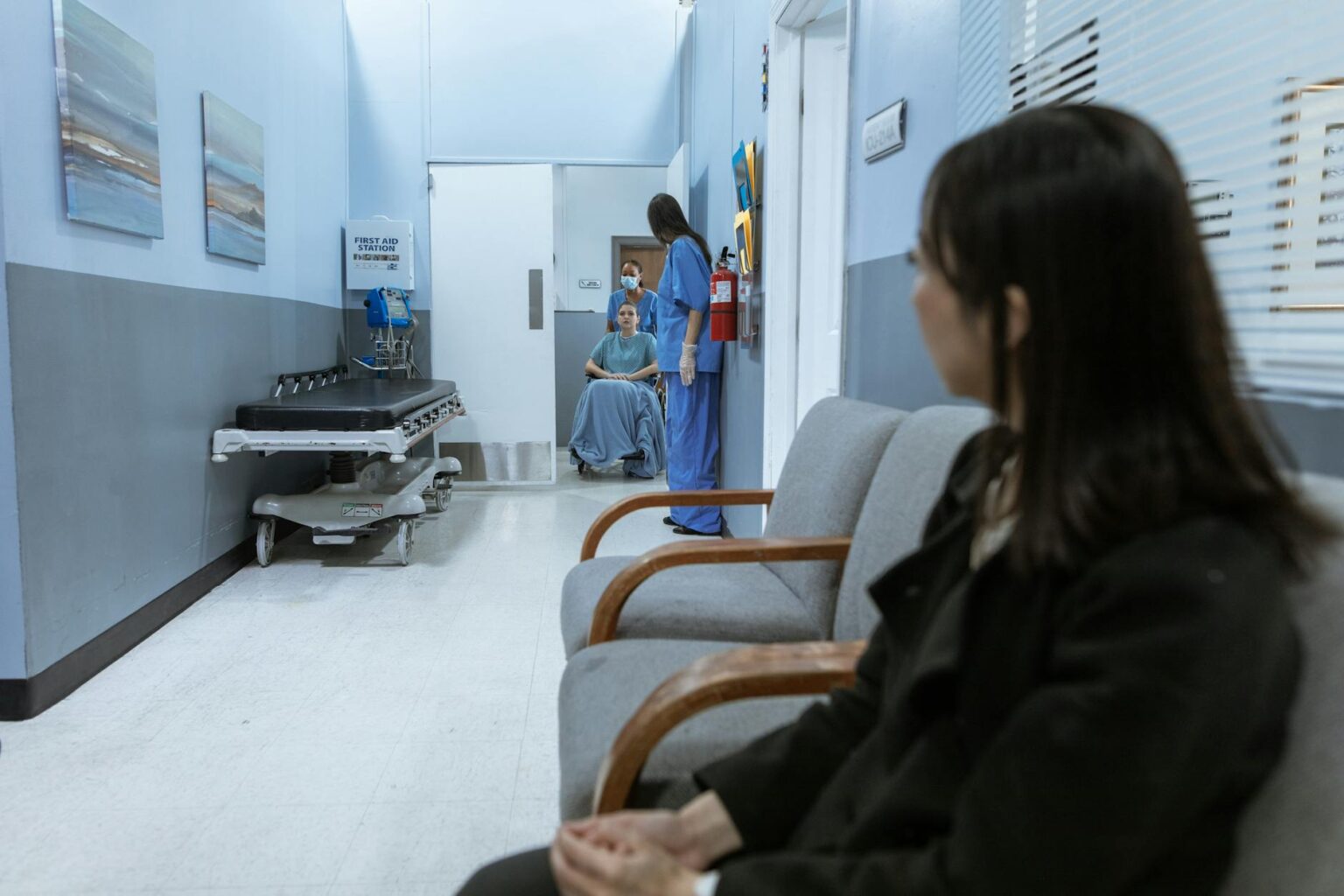 How AI Translation Is Helping Immigrants Navigate Healthcare Systems Hospital waiting room with diverse patients and families seeking medical care