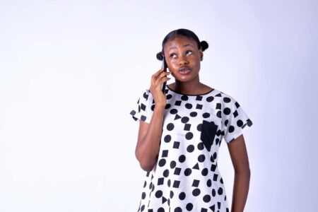 How Voice Commerce Is Changing Online Shopping Behavior Woman using voice commands on smartphone for hands-free shopping experience