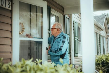Modern video doorbell mounted on front door entrance