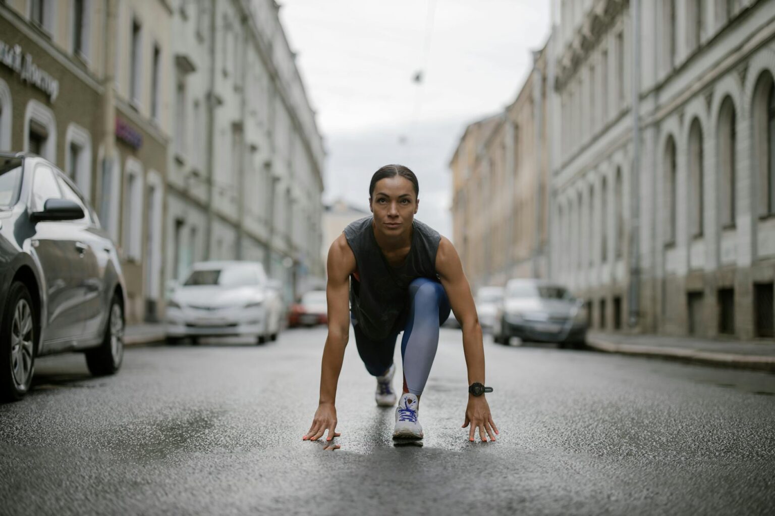 Comparing Fitbit Sense 3 and Garmin Venu 4 for Marathon Training Close-up view of modern fitness smartwatches displaying running metrics and data screens