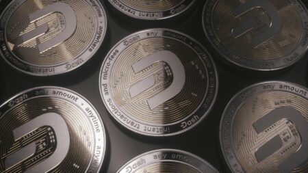 Collection of commemorative coins displayed on a dark surface