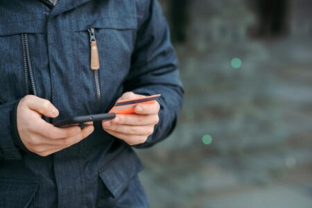 Venmo Quietly Shifts New Users to Private-Only Payments Person using mobile payment application on smartphone screen