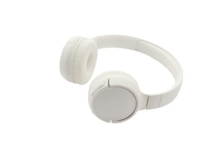 I overlooked this unique Sony headphone feature for years – Apple and Bose lack it Modern wireless headphones on desk with smartphone