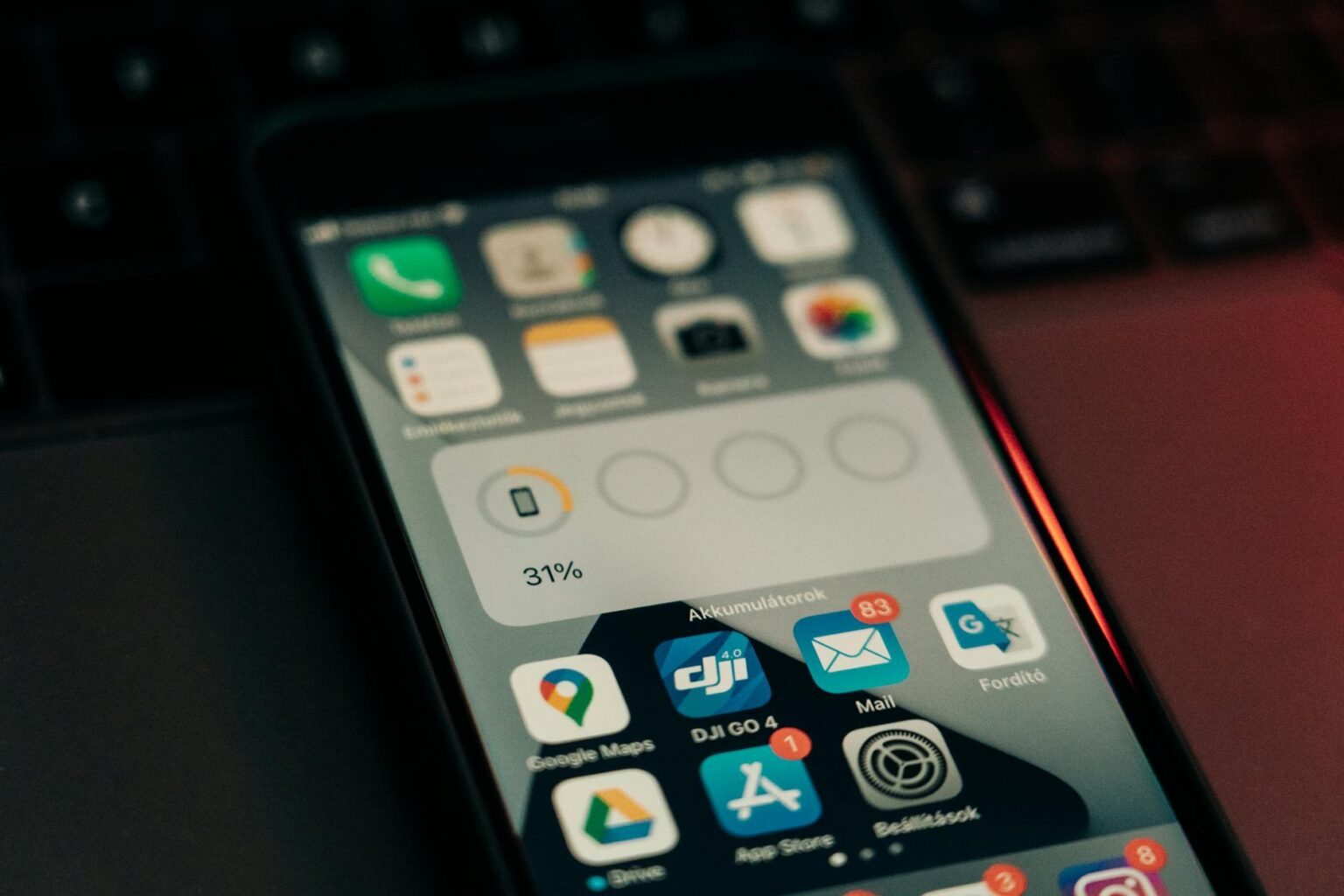 Apple Introduces Year-Long App Store Subscription Contracts Person using smartphone with App Store interface visible
