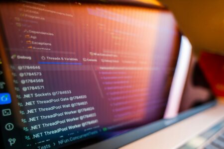 Design Startup Dessn Secures $6M for AI-Powered Production Tools Developer working on code interface showing programming languages