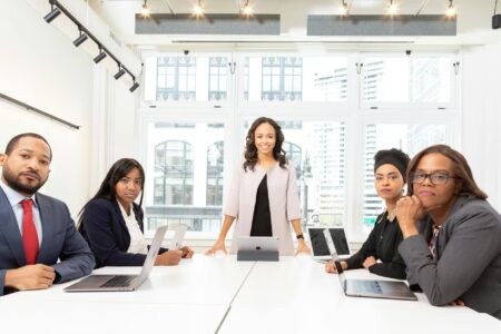 Enterprise Security Chiefs Push Application Risks to Board Rooms Corporate executives discussing strategy in modern boardroom