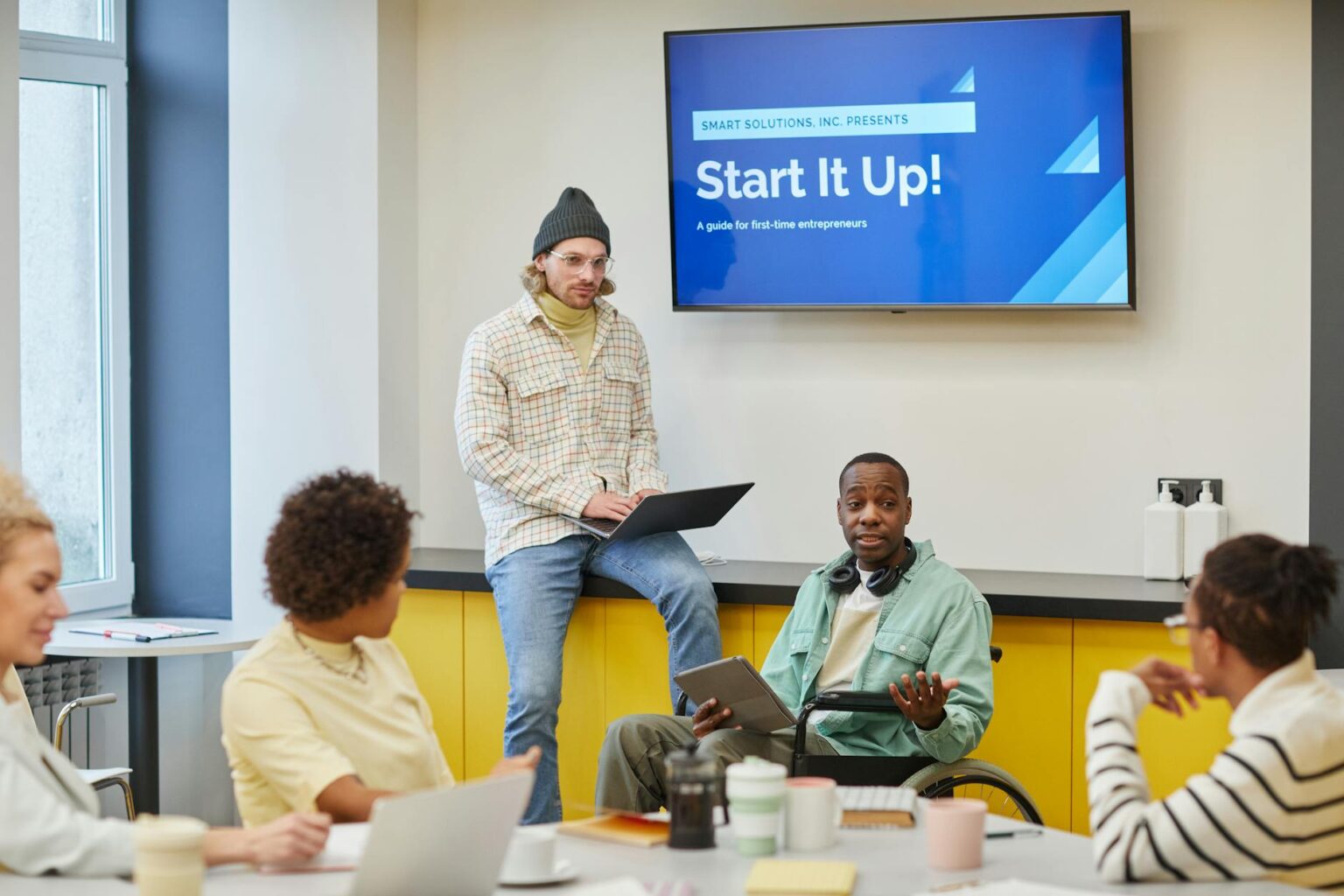 Voice AI Startup Vapi Reaches $500M Valuation After Ring Deal Business professionals in startup meeting discussing technology