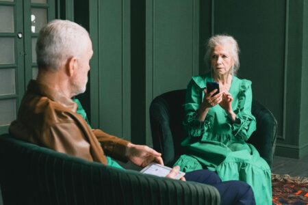 Meta Faces New Legal Challenge Over Fraudulent Platform Advertising Senior citizen using smartphone showing potential vulnerability to online scams