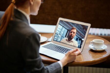 Microsoft Kills Teams Together Mode Over Technical Challenges People participating in a video conference call on computer screens