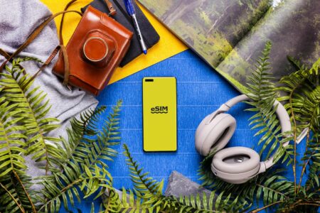 TikTok Converts Video Discovery Into Direct Booking Platform Person using smartphone to book travel accommodations