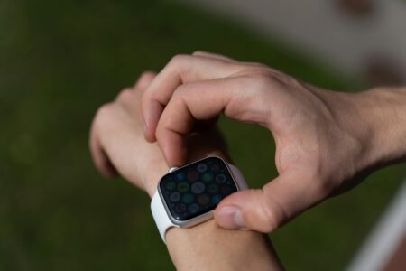 Fitbit Air Takes On Whoop With Screenless Design and AI Coaching Close-up of a screenless fitness tracker worn on a wrist