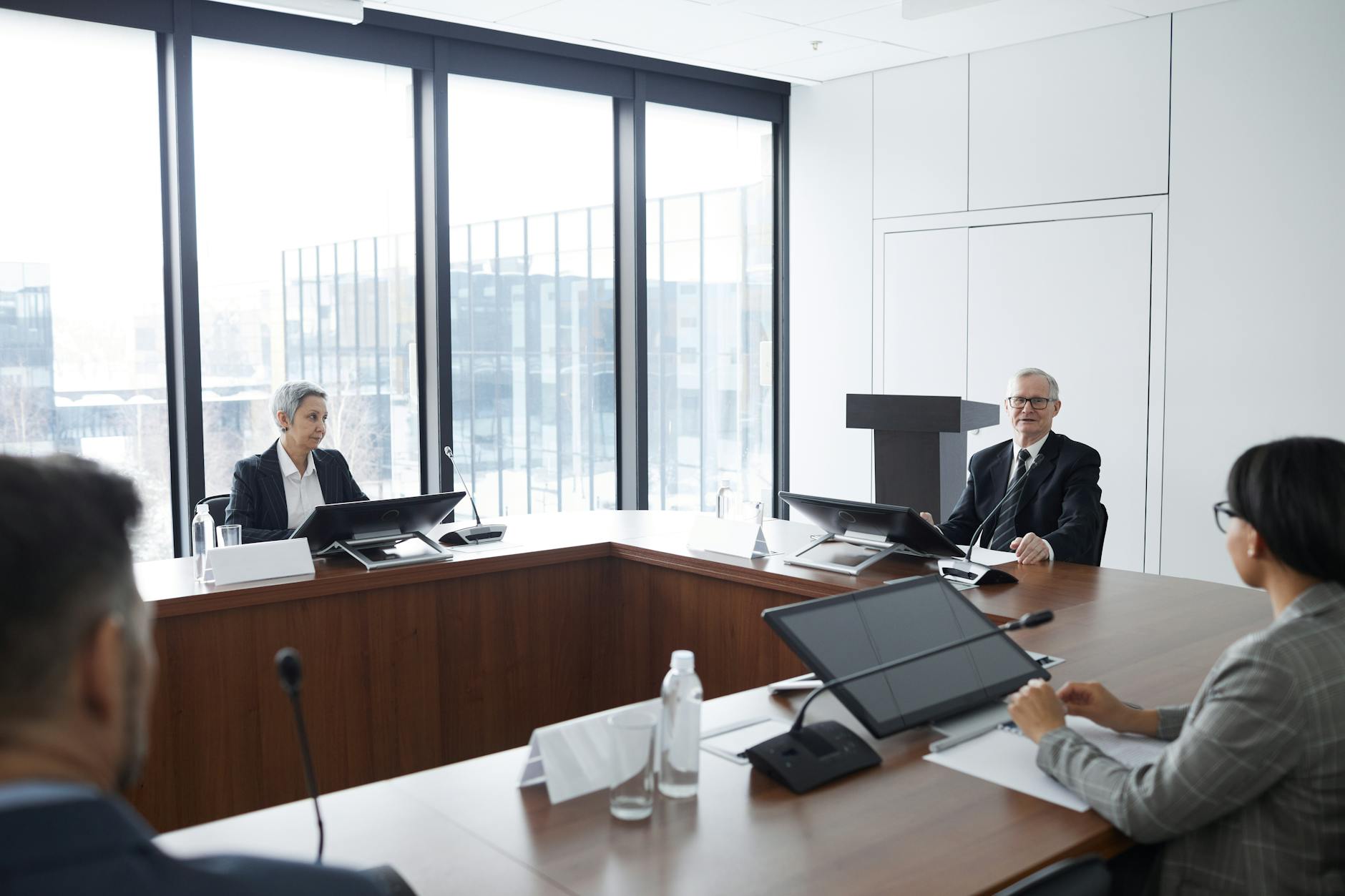 Corporate executives in heated discussion during board meeting