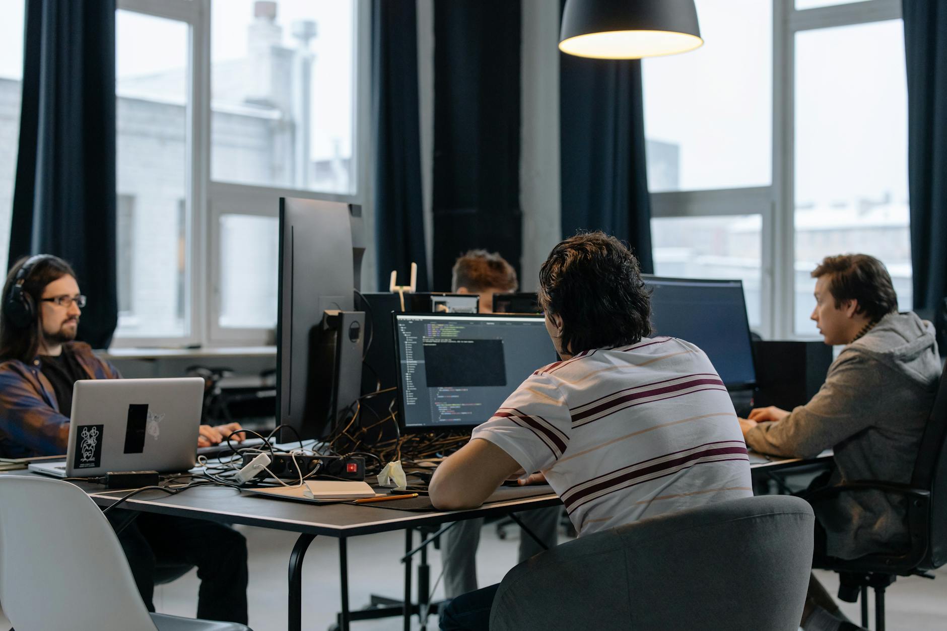 Modern technology office workspace with computers and monitors