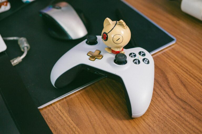 A gaming peripheral setup on a desk with controllers and accessories
