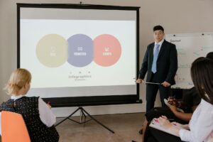 Founder presenting a startup pitch on stage at a technology conference