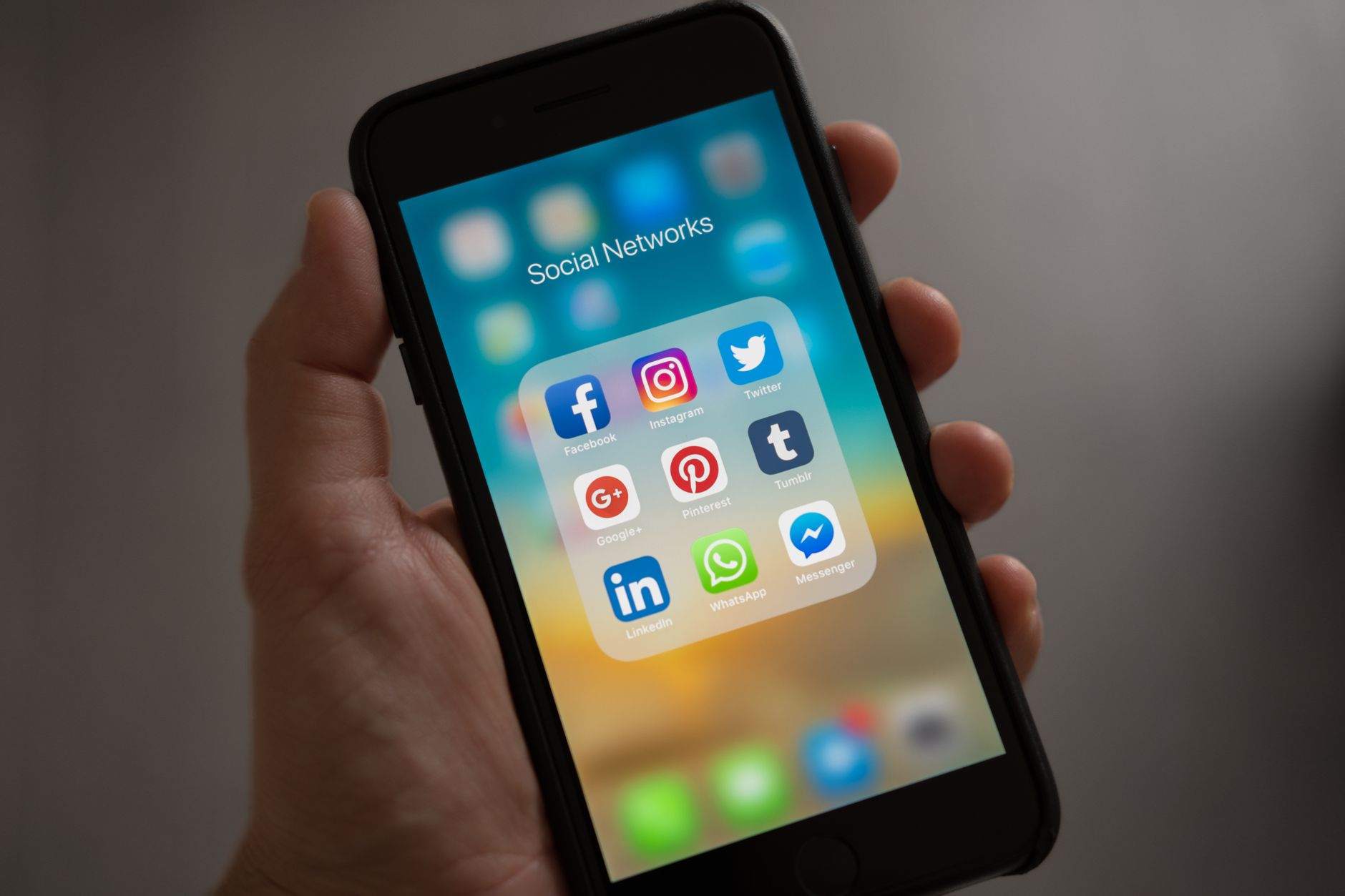 Person scrolling through a social media feed on a smartphone