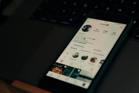 Person reviewing social media content on a laptop screen