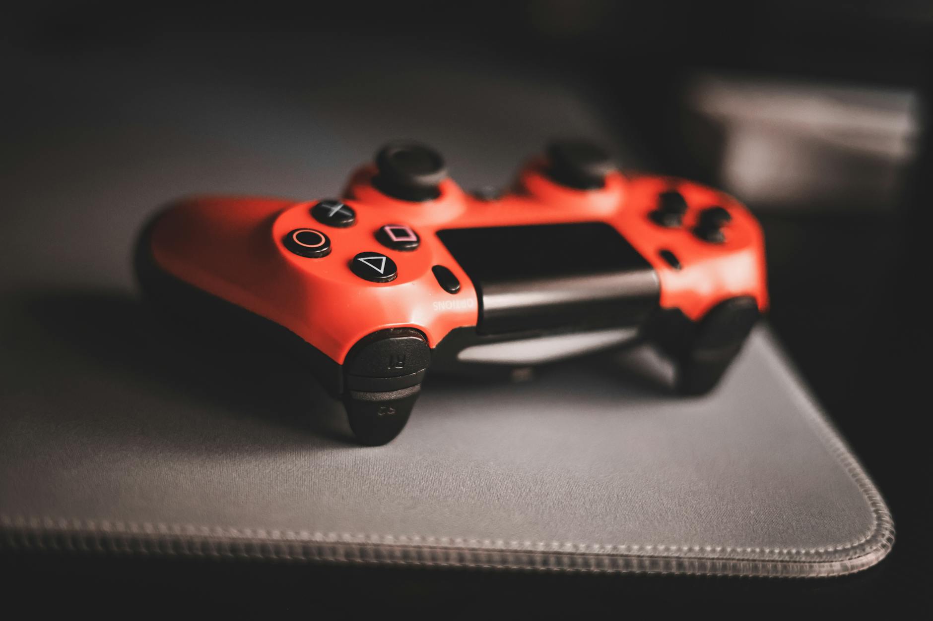 Close-up of an arcade-style fight stick controller on a gaming desk