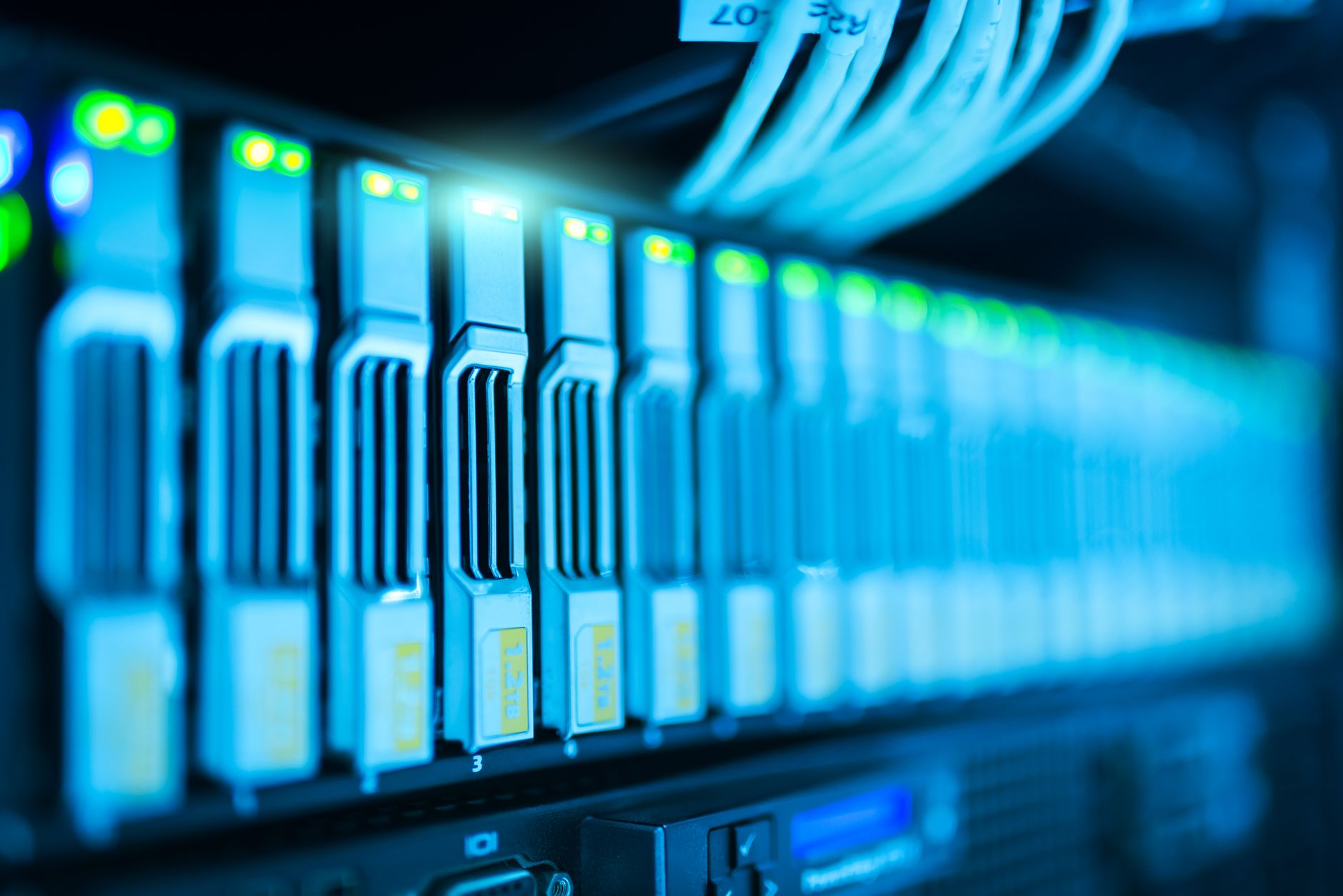 Rows of servers inside a large data center facility similar to xAI's Memphis Colossus cluster