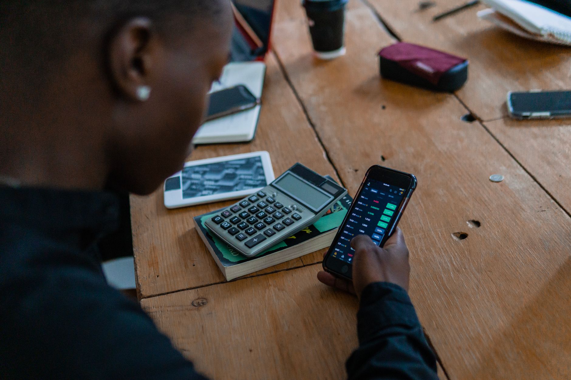 Person scrolling through a smartphone app representing digital attention and AI tool usage