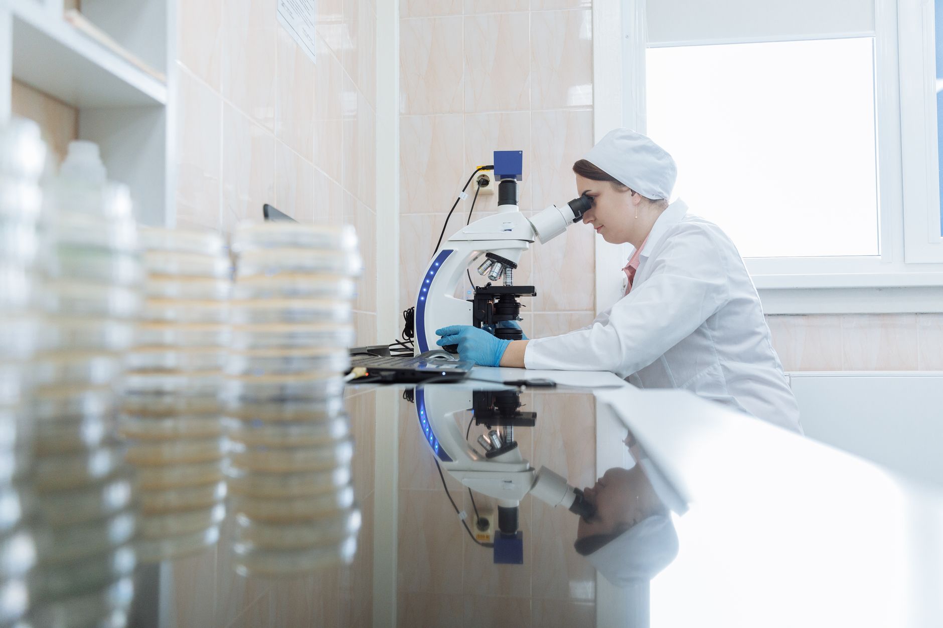 Scientist working in a biotech laboratory representing Life Biosciences aging reversal clinical trial