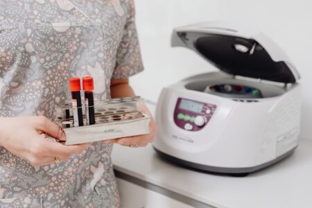 Scientist working in a fertility clinic laboratory with medical equipment