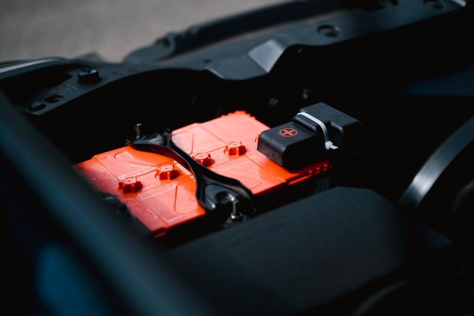 Researcher working on battery cells in a laboratory setting