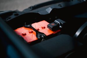 Researcher working on battery cells in a laboratory setting