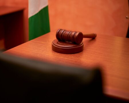 A wooden gavel resting on a court desk representing a federal court ruling