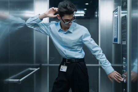 Person wearing smart glasses looking forward in an urban setting