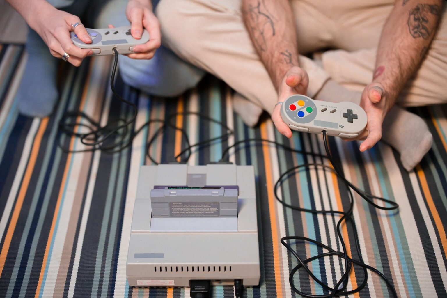 An old home video game console sitting on a shelf, representing early 1990s gaming hardware
