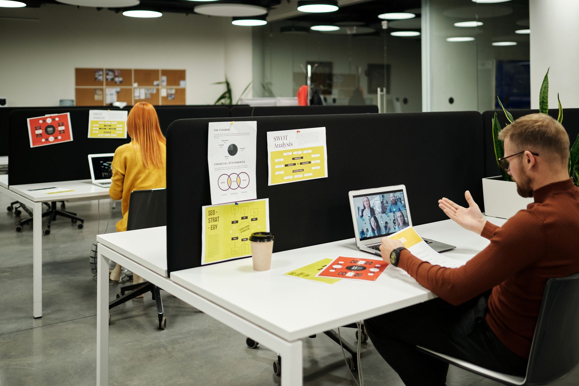 Person working at a computer terminal in a modern tech office environment