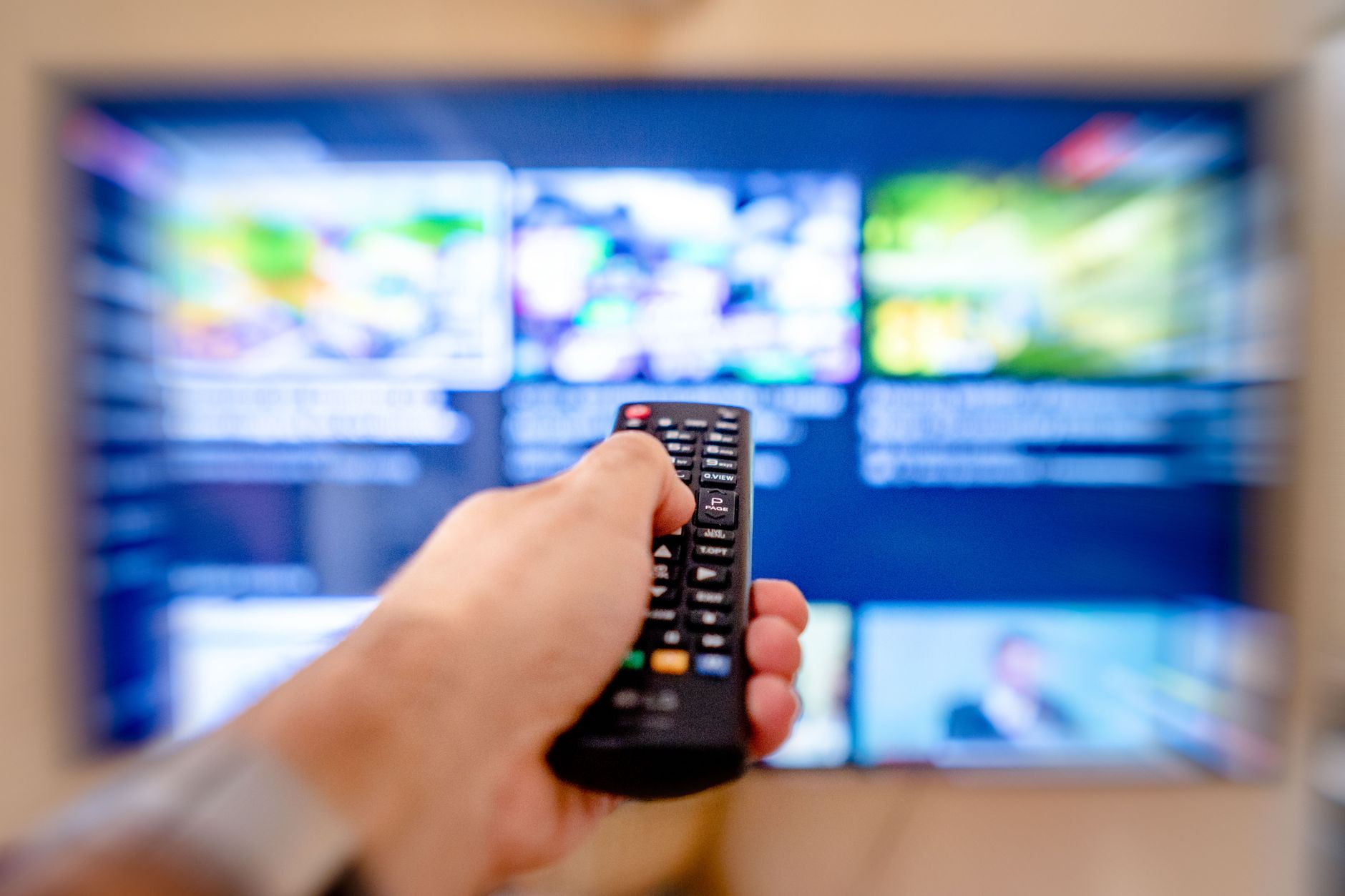 Person watching streaming content on a television at home
