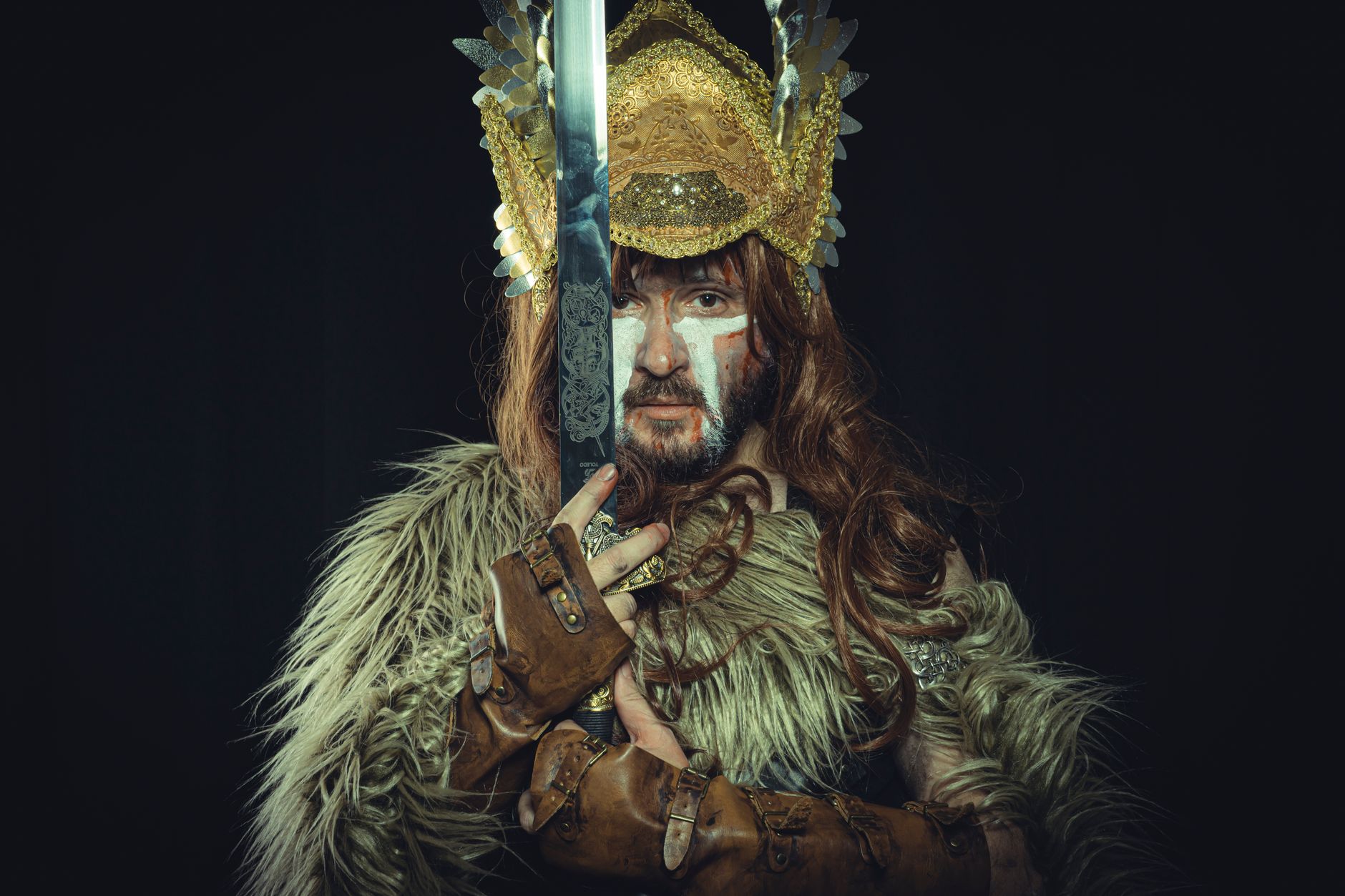 Stylized art depicting Norse mythological imagery and ancient symbols