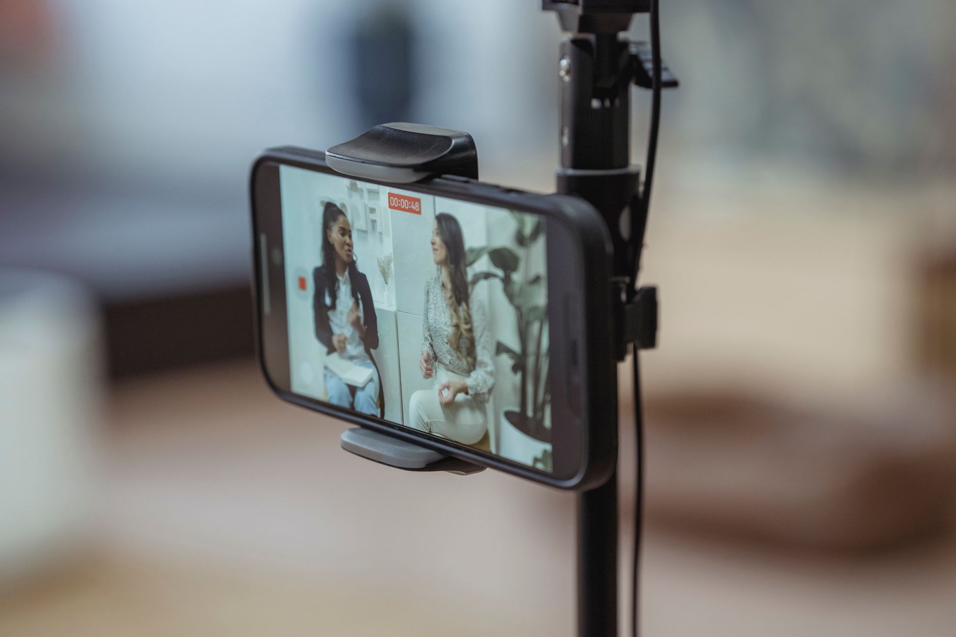 Close-up of a mobile phone displaying short-form video content